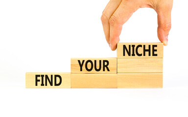 Find your niche symbol. Concept words Find your niche on wooden blocks. Businessman hand. Beautiful...