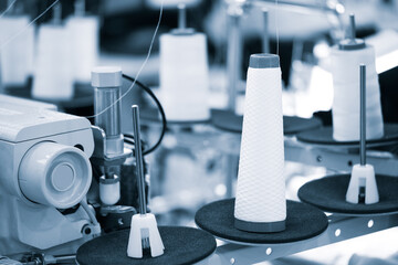 Sewing equipment, loom equipment at a garment factory, industrial concept background