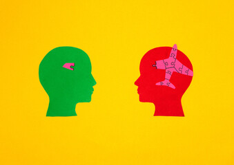 red and green paper head in one larger part of the puzzle in the other missing part, together have
a perfect business idea
