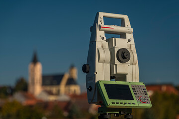 Surveyor machine near railway track in Bavorov town with sunrise soft colors