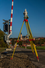 Surveyor machine near railway track in Bavorov town with sunrise soft colors