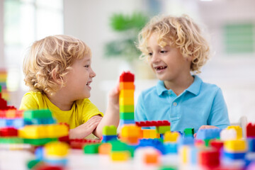 Obraz na płótnie Canvas Child playing with toy blocks. Toys for kids.
