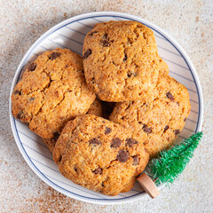 festive christmas cookie chocolate drops, cinnamon, ginger new year sweet dessert home food snack on the table copy space food background