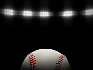Baseball ball on a black background under stadium lights