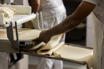 Industrial production of bakery products, preparing dough
