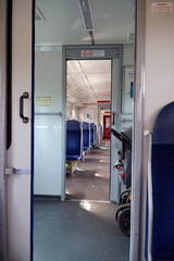 Railway car with electric train seats in Poland.
