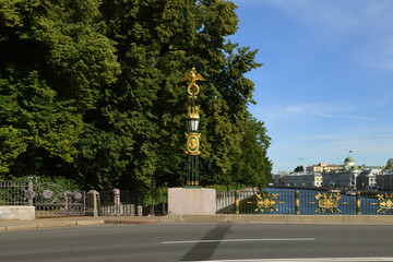 Fototapeta na wymiar Panteleymonovsky Bridge across Fontanka River. Lanterns and antique decorations. Saint Petersburg, Russia