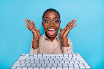 Photo of ecstatic joyful geek female scream in excitement have successfully close deal isolated on...