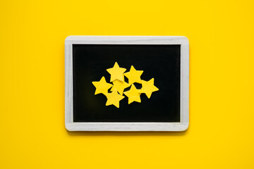 Customer Experience, Review Concept. Many yellow stars Negative Online Reviews rating in frame on yellow background. Customers Ratings and Reviews