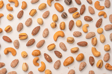  A group of almonds, pistachios, walnuts, macadamia, cashews.
