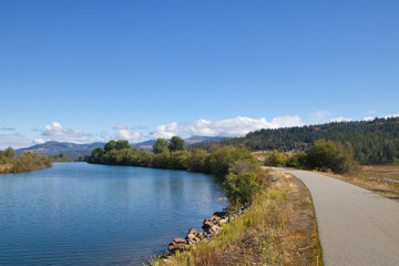On a sunny Autumn day in Northwestern Idaho, The Trail of the Coeur d'Alenes passes between...