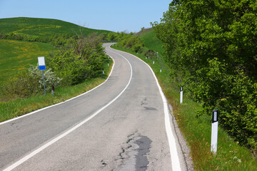 Amazing landscape of the Tuscan countryside with the typical rolling hills and cypresses to mark the boundaries