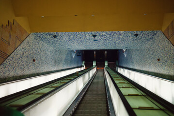 Electric escalators in metro. Moving staircases.