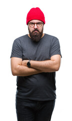 Fototapeta premium Young caucasian hipster man wearing glasses over isolated background skeptic and nervous, disapproving expression on face with crossed arms. Negative person.