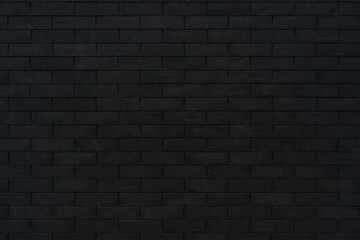 Black brick wall. Dark surface texture. Architectural building background.