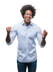 Afro american business man wearing glasses over isolated background celebrating mad and crazy for...