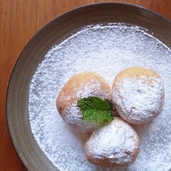 Sweet round bread with sugar powder on plate