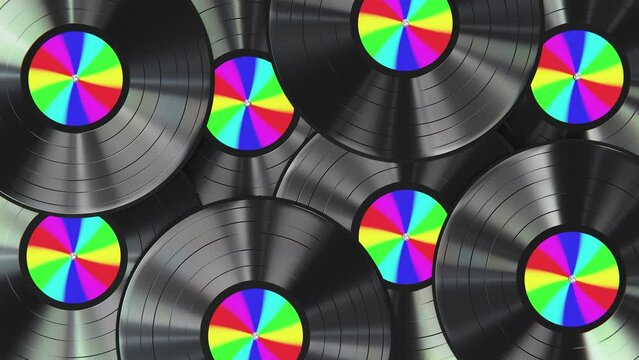 Realistic seamless looping 3D animation of the spinning classic black vinyl records with rainbow gradient labels rendered in UHD as motion background
