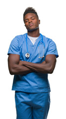 Young african american doctor man over isolated background wearing surgeon uniform skeptic and nervous, disapproving expression on face with crossed arms. Negative person.