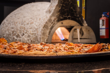 Delicious Italian Neapolitan pizza called pizza margherita fresh out of the oven.