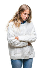 Obraz premium Beautiful young blonde woman wearing winter sweater over isolated background with hand on stomach because nausea, painful disease feeling unwell. Ache concept.