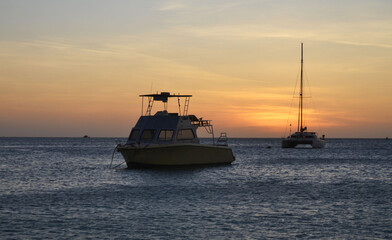 boats and a beautiful sunset on the happy island of Aruba