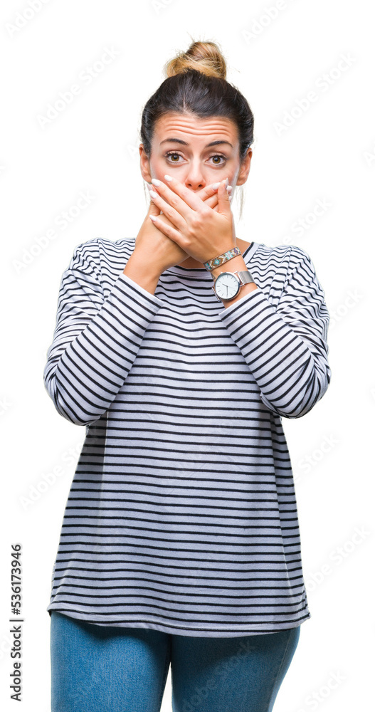 Wall mural Young beautiful woman casual stripes sweater over isolated background shocked covering mouth with hands for mistake. Secret concept.