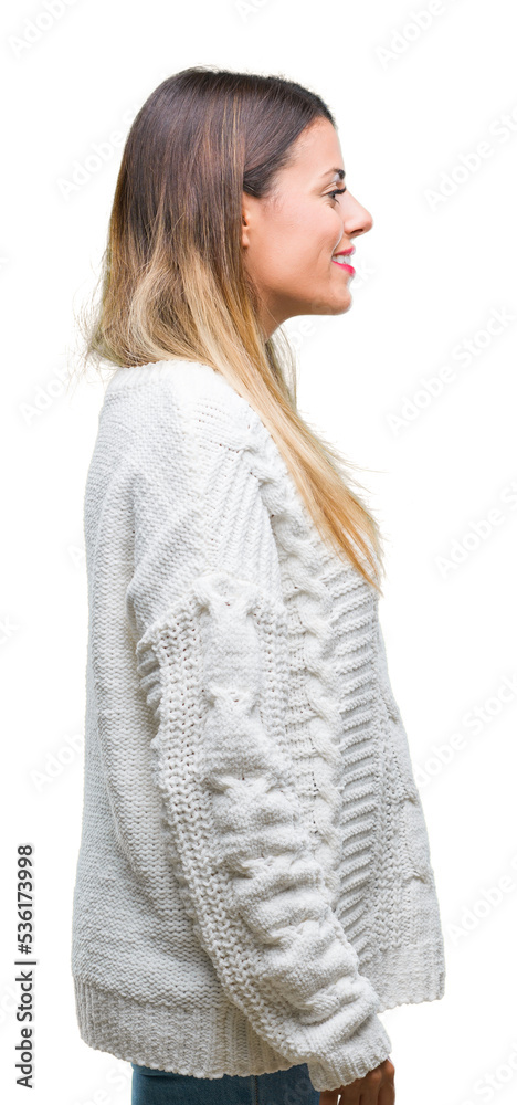 Wall mural Young beautiful woman casual white sweater over isolated background looking to side, relax profile pose with natural face with confident smile.