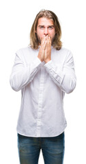 Young handsome man with long hair over isolated background shocked covering mouth with hands for mistake. Secret concept.