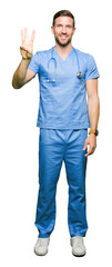 Handsome doctor man wearing medical uniform over isolated background showing and pointing up with fingers number three while smiling confident and happy.