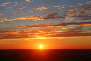 Fototapeta na wymiar Beautiful orange-blue sunset with clouds.