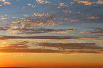 Beautiful orange-blue sunset with clouds.