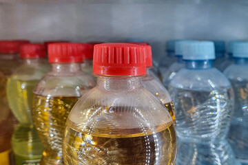 Drinks in plastic bottles with red and blue caps.