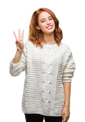 Young beautiful woman over isolated background wearing winter sweater showing and pointing up with fingers number three while smiling confident and happy.