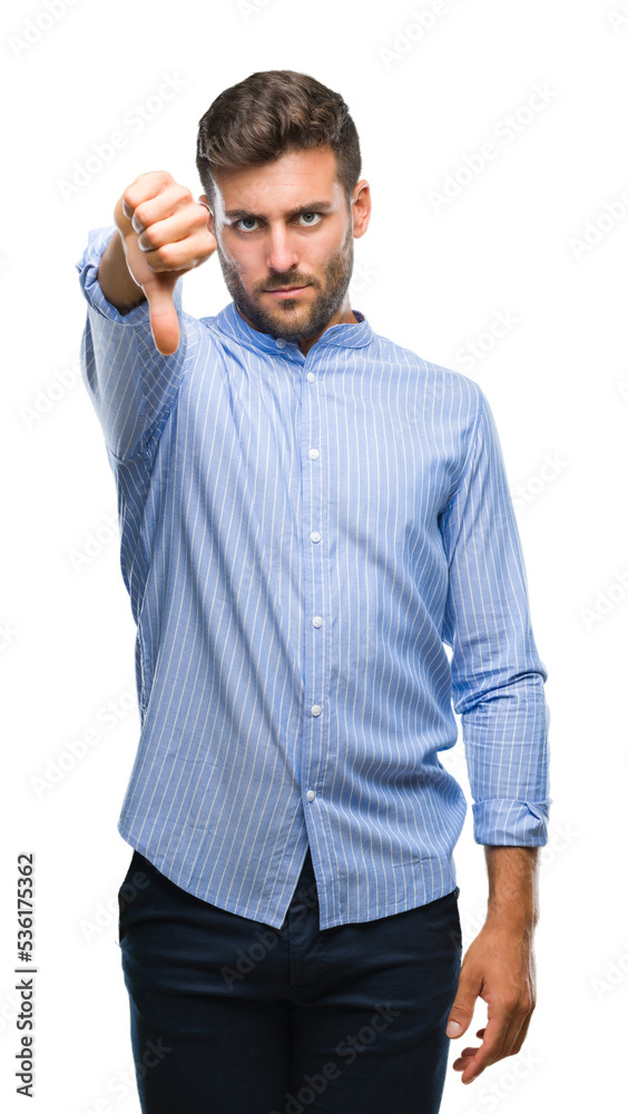 Sticker Young handsome man over isolated background looking unhappy and angry showing rejection and negative with thumbs down gesture. Bad expression.