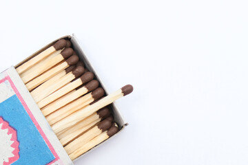 Match box full of matches close up on white background with copy space