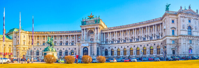 Panoramic view on main facade of Hofburg Palace with large car parking, on February 17 in Vienna, Austria