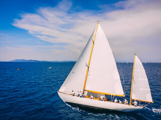 Classic wooden sailing ketch participating in regatta in the Mediterranean sea.