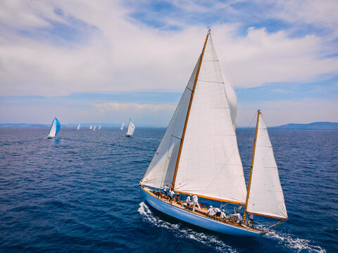 Classic wooden sailing ketch participating in regatta in the Mediterranean sea.