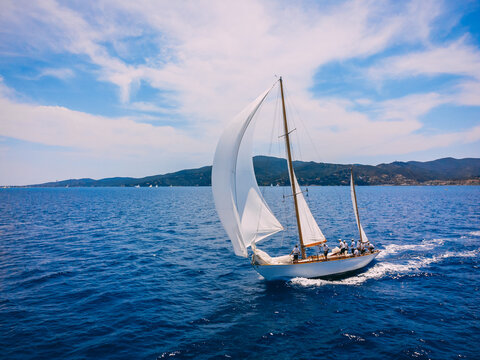 Classic wooden yacht sailing in regatta in the Mediterranean sea.