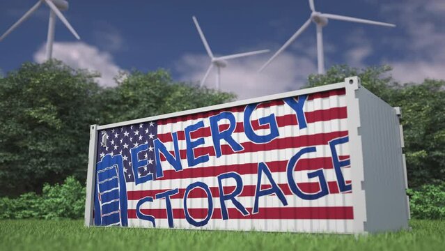 Flag of the USA and ENERGY STORAGE text on a battery container at wind turbines, 3d animation