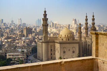 Top view of Sultan Hassan Mosque and the city of Cairo in the background