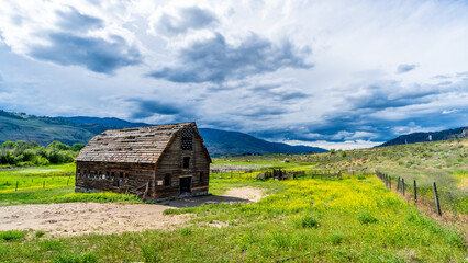 Large abandoned dilapidated barn in the Okanagen Valley between the towns of Oliver and Osoyoos, British Columbia, Canada