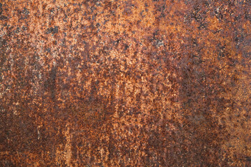 Dark light red rusty metal plate. Grunge texture. Rusty metal background. Rusty orange texture. Rust.