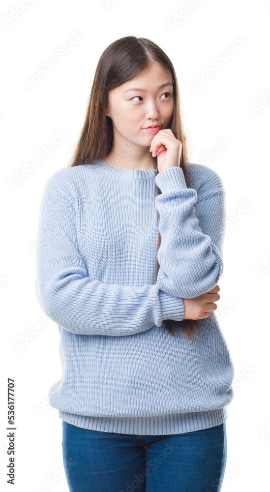 Sticker young chinese woman over isolated background with hand on chin thinking about question, pensive expr