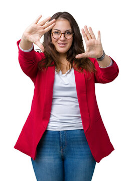 Beautiful plus size young business woman wearing elegant jacket and glasses over isolated background Smiling doing frame using hands palms and fingers, camera perspective
