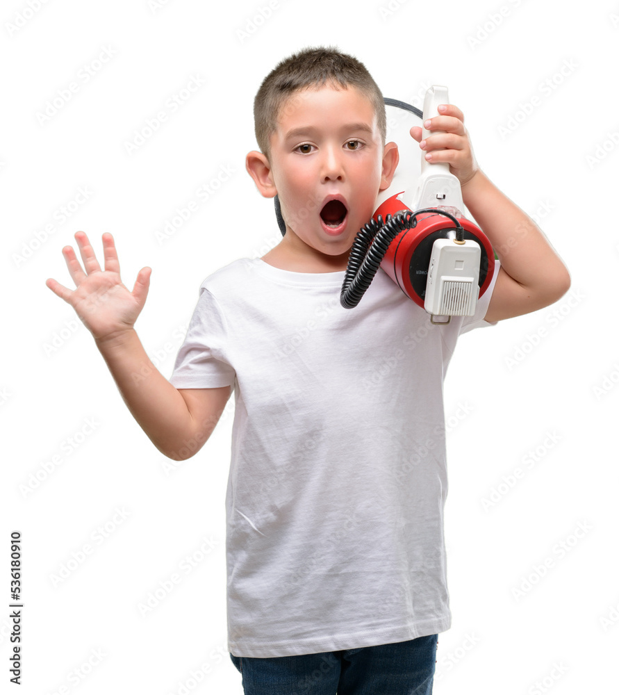 Poster Dark haired little child holding megaphone very happy and excited, winner expression celebrating victory screaming with big smile and raised hands