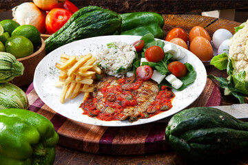 Beef steak with potatoes and rice
