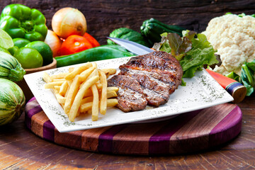 French fries with steak in isolated white background