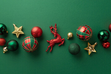Christmas decorations concept. Top view photo of reindeer star ornaments gold green and red baubles...